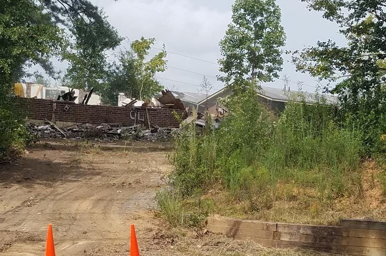 Remains of a portion of the Bolton Road Apartments after being demolished